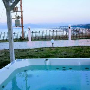 a swimming pool with a view of the water at Villa Blue Apartments in Agia Triada