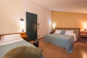 Voodi või voodid majutusasutuse Hotel Montreal toas