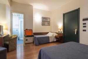 Voodi või voodid majutusasutuse Hotel Montreal toas