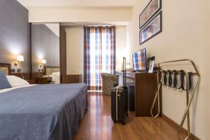 Voodi või voodid majutusasutuse Hotel Montreal toas