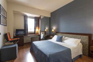 Voodi või voodid majutusasutuse Hotel Montreal toas