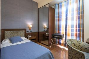 Voodi või voodid majutusasutuse Hotel Montreal toas