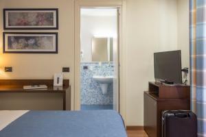 Voodi või voodid majutusasutuse Hotel Montreal toas