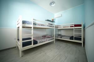 Łóżko lub łóżka w pokoju w obiekcie Salento Sea & Sun