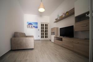 Telewizja i/lub zestaw kina domowego w obiekcie Salento Sea & Sun