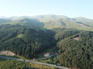 an aerial view of a mountain with a house and a road at LerMont Guest House in Lermontovo