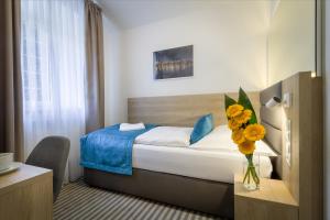 Krevet ili kreveti u jedinici u okviru objekta Hotel White Lion
