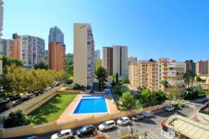 a city with a swimming pool in a parking lot at Cadiz 4-B in Benidorm