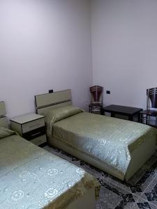 Postel nebo postele na pokoji v ubytování Hotel Gjeli
