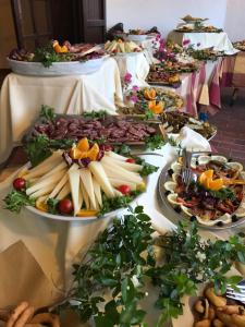 a buffet line with many plates of food at Hotel Su Meriagu in Capitana +28 photos