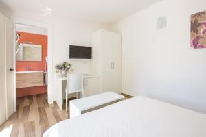 سرير أو أسرّة في غرفة في Albergo Labotte
