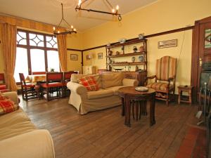 a living room with a couch and a table at Quaint Holiday Home in Bouillon Ardennes in Bouillon