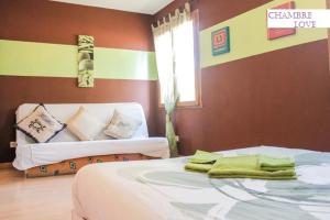 a bedroom with two beds and a window at villa fleur de sel in Cuges-les-Pins