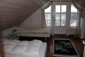 เตียงในห้องที่ Skipperhus Skjærhalden