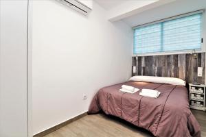 Łóżko lub łóżka w pokoju w obiekcie Agua Azul 4-A Apartment Levante-Rincon de Loix