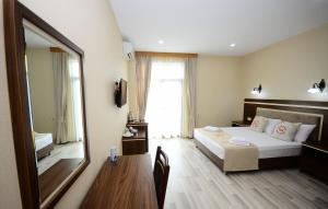 Postel nebo postele na pokoji v ubytování Hotel 725 B