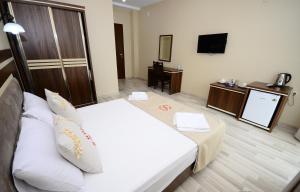 Postel nebo postele na pokoji v ubytování Hotel 725 B
