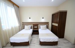 Postel nebo postele na pokoji v ubytování Hotel 725 B