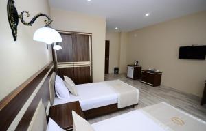 Postel nebo postele na pokoji v ubytování Hotel 725 B