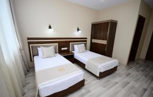 Postel nebo postele na pokoji v ubytování Hotel 725 B