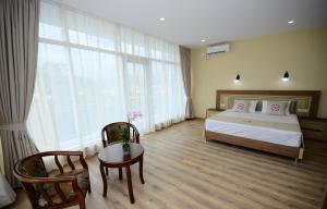 Postel nebo postele na pokoji v ubytování Hotel 725 B