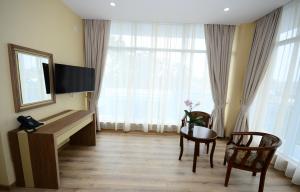 TV a/nebo společenská místnost v ubytování Hotel 725 B