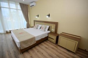 Postel nebo postele na pokoji v ubytování Hotel 725 B