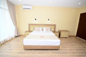 Postel nebo postele na pokoji v ubytování Hotel 725 B