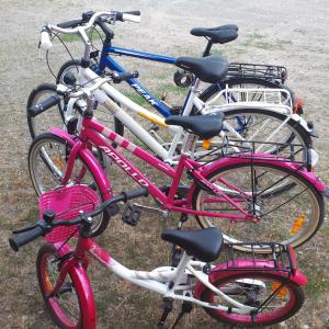 a group of three bikes parked next to each other at Stenaberg in Kungsbacka