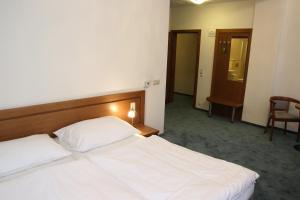 Postel nebo postele na pokoji v ubytování Apartmán Lednice
