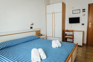 Postel nebo postele na pokoji v ubytování Hotel Montecarlo