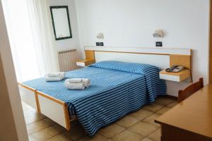 Postel nebo postele na pokoji v ubytování Hotel Montecarlo