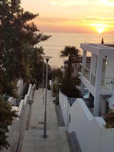 a view of a street with the sunset in the background at 7a Clifton Steps in Cape Town