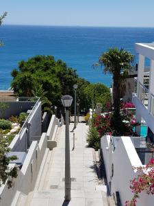 a sidewalk with a view of the ocean at 7a Clifton Steps in Cape Town