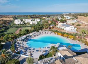 an aerial view of a resort with a swimming pool at VOI Marsa Siclà Essentia in Sampieri