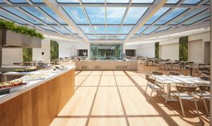 a large dining room with tables and chairs at VOI Marsa Siclà Essentia in Sampieri