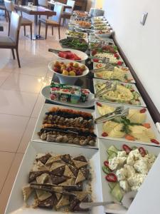 a buffet line with many different types of food at Enar Hotel in Kırıkkale