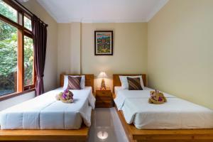 Voodi või voodid majutusasutuse Alam Pangkung Ubud toas