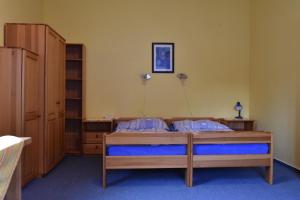 Posteľ alebo postele v izbe v ubytovaní Penzion Bělidlo