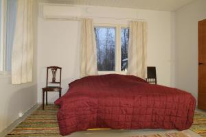 Un pat sau paturi într-o cameră la Arkkosen-Alajoki-Tupa