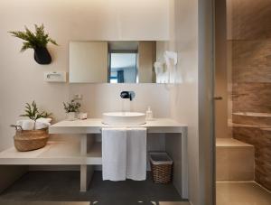 a bathroom with a sink and a mirror at VOI Marsa Siclà Essentia in Sampieri