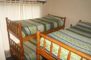 Un ou plusieurs lits dans un hébergement de l'établissement Cabañas 4 Esquinas