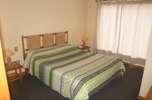 En eller flere senge i et værelse på Cabañas 4 Esquinas