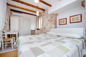 Cama o camas de una habitación en Apartment and Studio CA’ 3 VIE