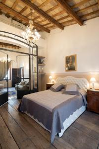 Giường trong phòng chung tại Caterina Residenza