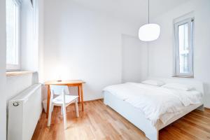 Postel nebo postele na pokoji v ubytování Grand Central Apartment