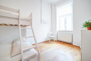 Postel nebo postele na pokoji v ubytování Grand Central Apartment