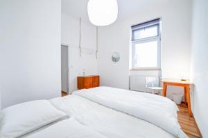 Postel nebo postele na pokoji v ubytování Grand Central Apartment