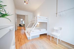 Postel nebo postele na pokoji v ubytování Grand Central Apartment + 11 fotografií