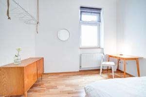 Postel nebo postele na pokoji v ubytování Grand Central Apartment